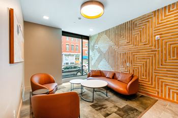 A room with a patterned wall and a couch